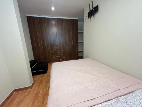 Katil atau katil-katil dalam bilik di Cómodo apartamento en cayma