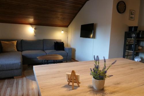 a living room with a couch and a table at Haus Katris in Mauterndorf