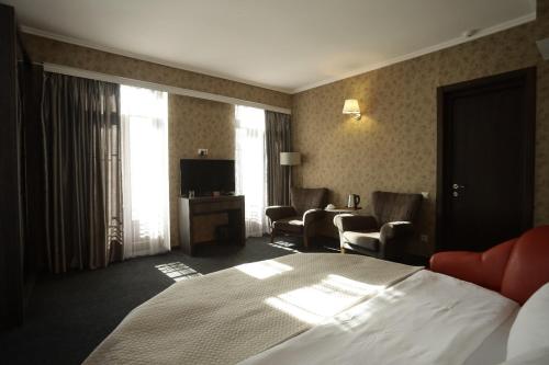 Postel nebo postele na pokoji v ubytování Redline Hotel