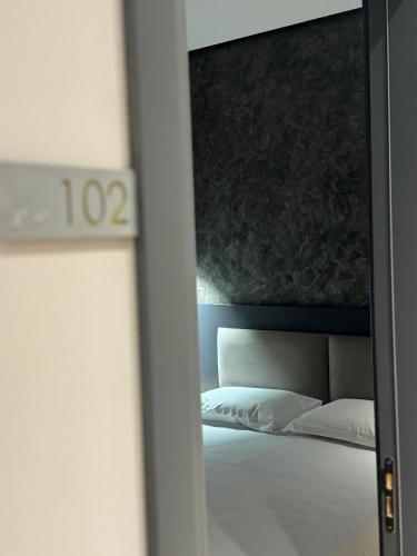 Katil atau katil-katil dalam bilik di Center Boutique Hotel