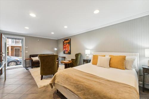 a bedroom with a bed and a living room at 308 W Taylor Street Garden in Savannah