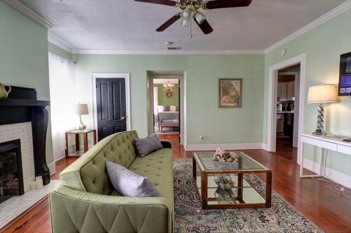 a living room with a couch and a fireplace at 121 W Jones Suite Loft 4f in Savannah