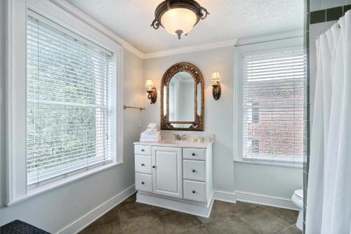 a bathroom with a sink and a mirror at 121 W Jones Suite Loft 4f in Savannah