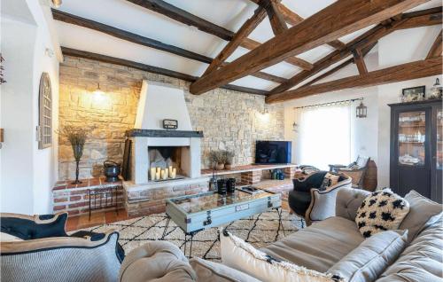 a living room with a couch and a fireplace at Villa Novel in Višnjan