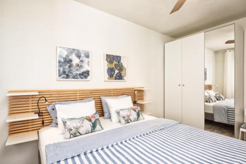 En eller flere senge i et værelse på Casa El Puerto by Huskalia