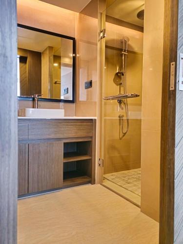a bathroom with a sink and a shower at 2 BDR Suite in 5 Star Hotel in Rawai Beach