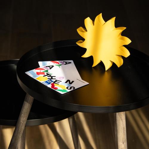 a table with a star and playing cards on it at Fits Living in Athens