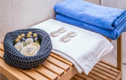 a basket of bottles on a table in a bathroom at Villa Orljak in Buzet