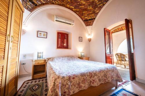 Postel nebo postele na pokoji v ubytování villa al diwan luxor