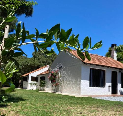 a white house with a red roof at Casa Oceana in Chapadmalal