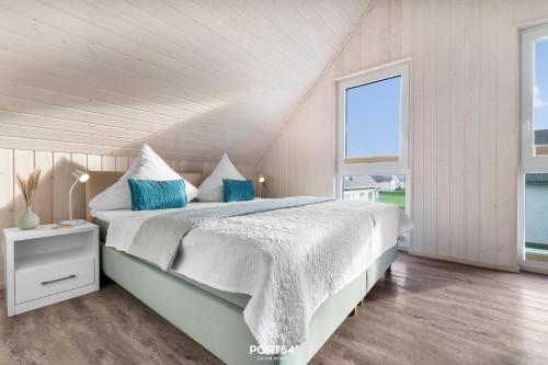 Postel nebo postele na pokoji v ubytování Ferienhaus Huus Luv