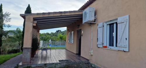 an entrance to a house with an open doorway at Spacious Villa with Pool in Pruna, 140 m² in Pruna