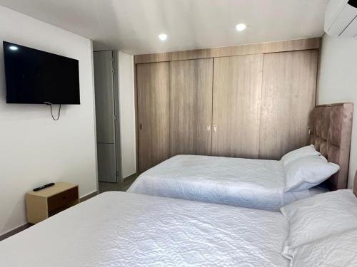 Postel nebo postele na pokoji v ubytování Disfruta Neiva desde las alturas Apartamento de lujo hasta para 6 personas con espectacular vista y zonas sociales de ensueño