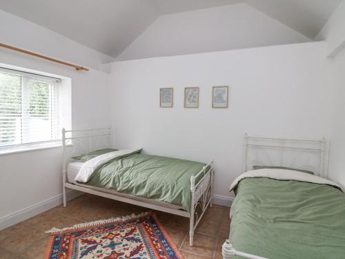 Postel nebo postele na pokoji v ubytování Bayside Cottage