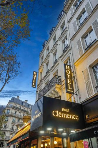 a hotel elegance sign in front of a building at Hôtel Clémence in Paris