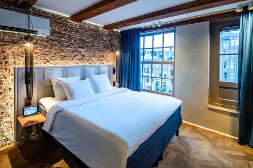 Postel nebo postele na pokoji v ubytování Mister Highland Hotel