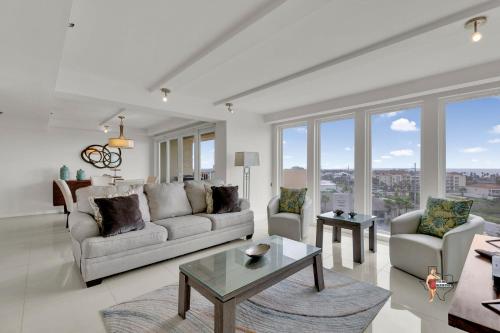 a living room with a couch and a table at Bahia Mar-Solare Tower, Beachfront Resort with Two Pools in South Padre Island