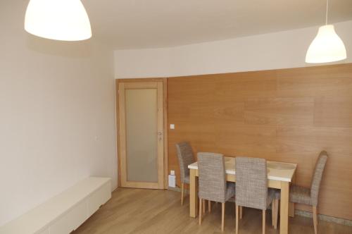 a dining room with a table and chairs at Apartmá 11 Deštné v Orlických horách in Deštné v Orlických horách