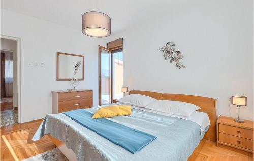 a bedroom with a bed with a blue blanket at Villa Mendula in Potpićan