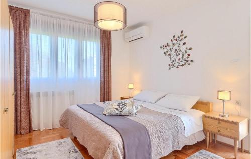 a bedroom with a bed with a zebra pillow on it at Villa Mendula in Potpićan