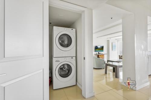 a laundry room with a washer and dryer at Bahia Mar-Solare Tower, Beachfront Resort with Two Pools in South Padre Island