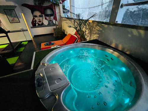 a bathroom with a sink with blue water in it at Baipho Lifestyle in Patong Beach