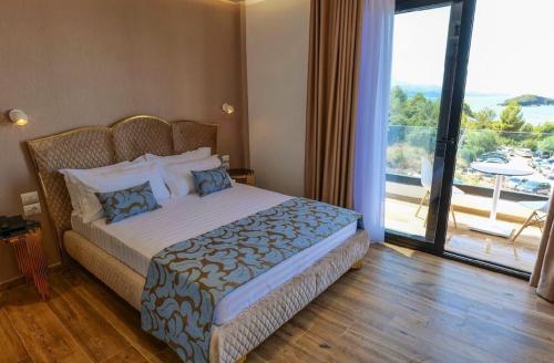 Кровать или кровати в номере Bora Bora Hotel Ksamil
