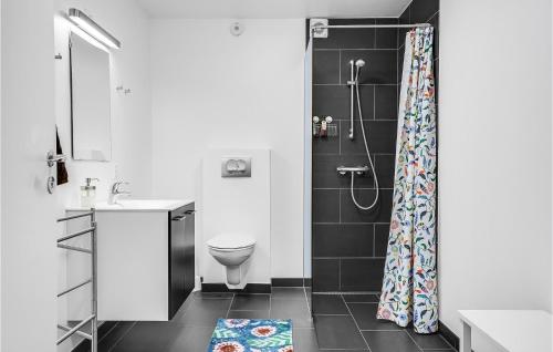 a bathroom with a toilet and a shower at Beautiful Apartment In Ebeltoft in Ebeltoft