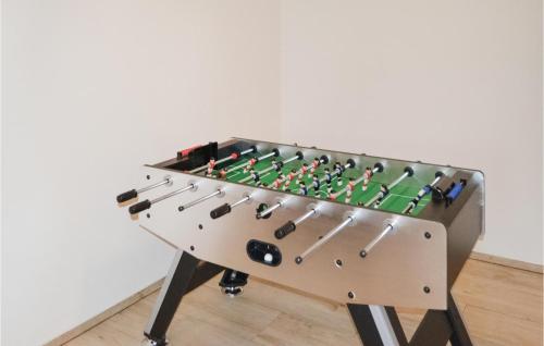 a foosball table with a chess board on it at Holiday Home Sæby 59 in Nordost