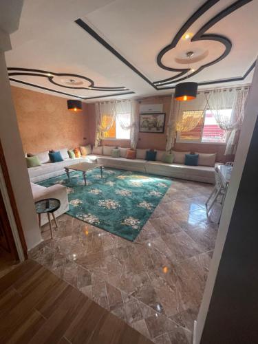 a living room with a couch and a table at حي الزهراء in Khenifra