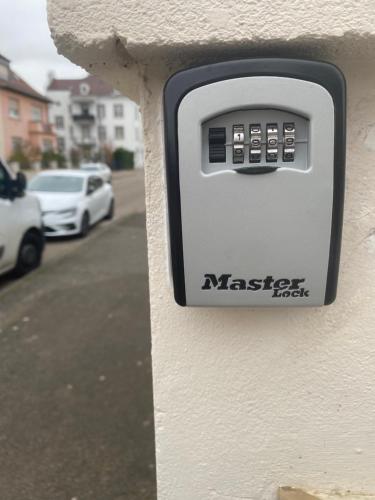 a metal mail box with a visa sign on it at Dépendance de charme - Tiny house in Colmar