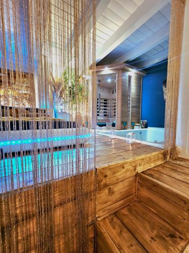 a large bathroom with a large glass wall at AMA Esclusive SPA Bologna in Bologna