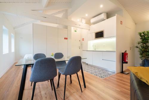 a dining room with a table and chairs at Host Wise - Large Colourful Flats - Ace Location in Vila Nova de Gaia