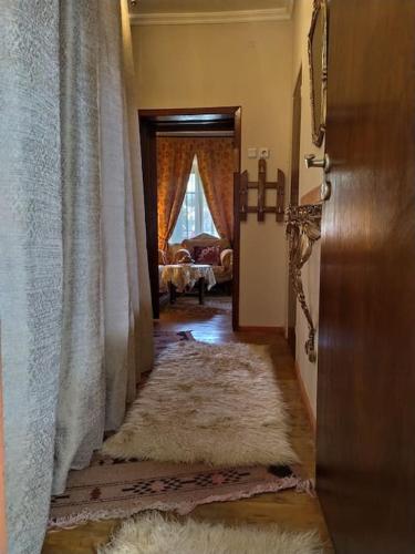 a hallway with a door leading to a living room at Traditional house at Pelion seaside in Agria