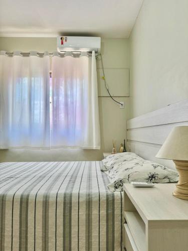 Postel nebo postele na pokoji v ubytování Quarto em apto compartilhado com anfitrião