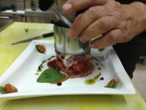 a person is eating a dessert on a plate at Villa Madau in Pula