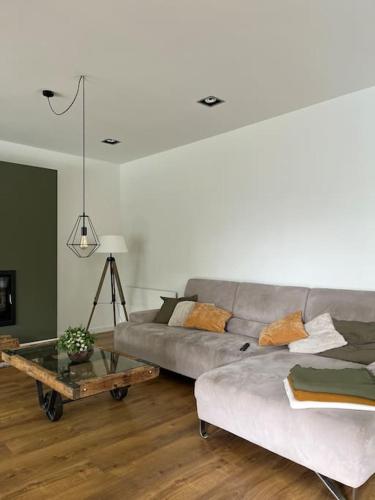 a living room with a couch and a coffee table at Casa Mont-mar in Montrás