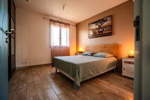 Posteľ alebo postele v izbe v ubytovaní La villa de Domi 4 chambres piscine