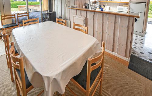 a table in a kitchen with a table and chairs at Holiday Home Teglbakken Vi in Egernsund