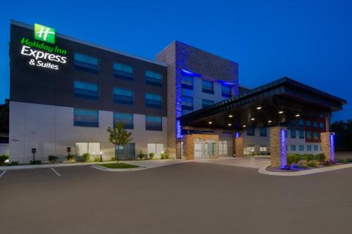 an office building with a parking lot in front of it at Holiday Inn Express & Suites Muskegon - Grand Haven by IHG in Muskegon