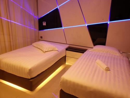 Una cama o camas en una habitación de Hotel Vevo Puchong Malaysia