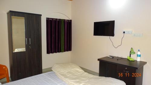Katil atau katil-katil dalam bilik di Nirmalyam Homestay