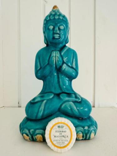 a green statue sitting on top of a table at Villa Solborg in Mölnlycke