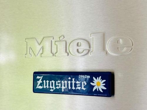 a sign that says mitzaho with a flower on it at Villa Solborg in Mölnlycke
