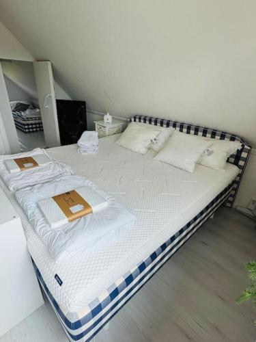 a bed in a room with two boxes on it at Villa Solborg in Mölnlycke