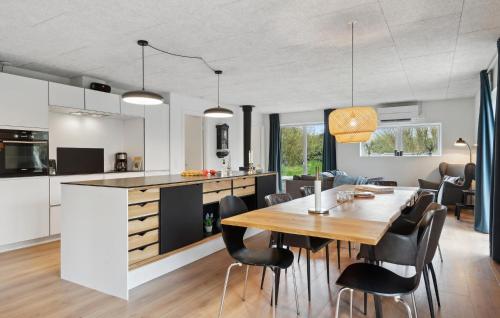 a kitchen and dining room with a table and chairs at Gorgeous Home In Hjerm With Kitchen in Hjerm