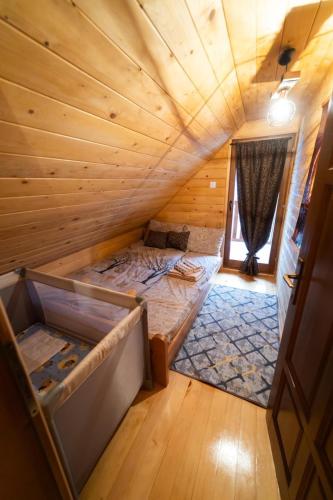 an overhead view of a bedroom in a log cabin at Brvnara Nina in Kremna