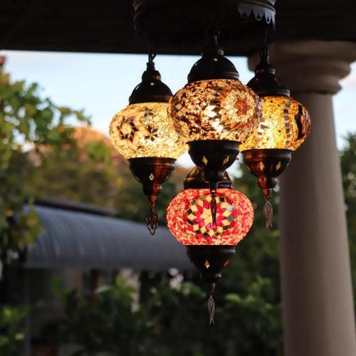 a group of three lights hanging from a porch at du Repos (Lovely & Relaxing 2-Bedroom Unit with Patio) in Springbok