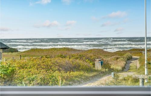 a view of the ocean from a window at Three-Bedroom Holiday Home In Blokhus in Blokhus