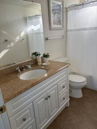 a bathroom with a sink and a toilet at Newport Beach Rendezvous in Newport Beach